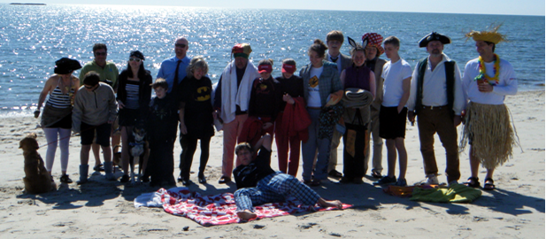 Sturgis Charter Public School faculty and students prepare to enter the frigid water at West Dennis Beach to raise money for CARE’s Sampson Fund