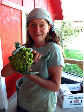 Tamara shows off the organic crops grown on the Valley Dream Farm.