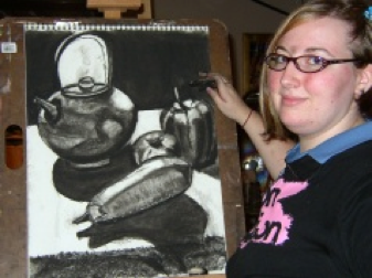 Sarah Holl's intern Amy Hufnagle with charcoal drawing 