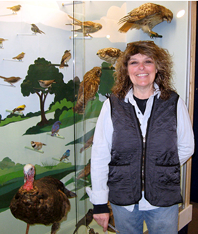 Barbara Knoss at the Bird Alley display Photograph by Barbara Struna