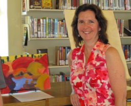 Bernadette at an exhibition of her students' artwork 