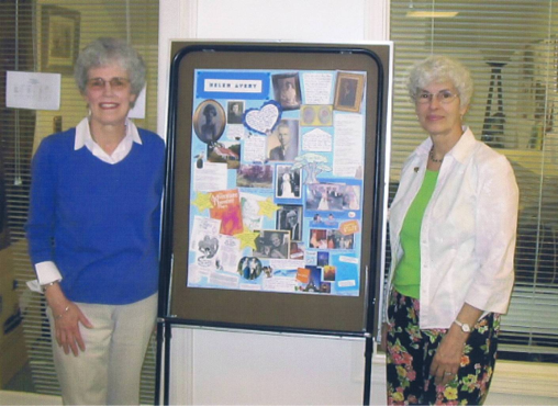Barbara Nagle (right) and the daughter of a Beacon Hospice patient display a  "Chart-A-Life" poster.  Photo is courtesy of Beacon Hospice, Inc. 